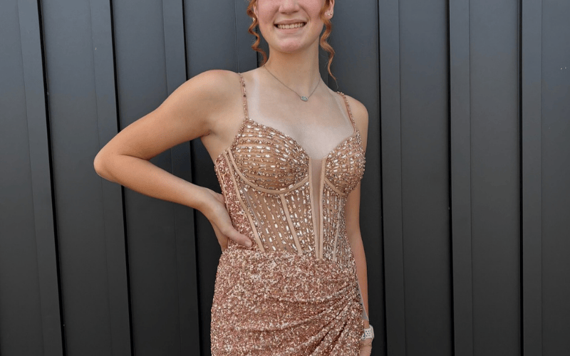 woman wearing a bold homecoming dress